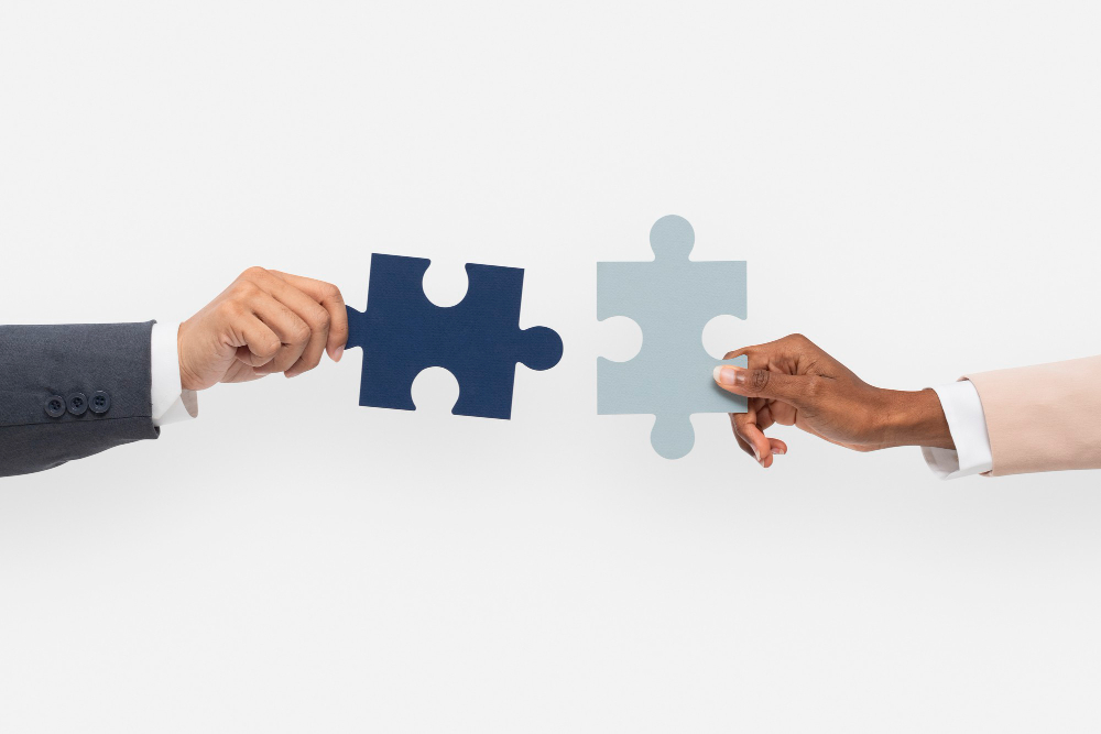 Hands Holding Puzzle Business Problem Solving Concept (1)